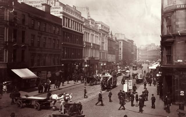 Passers-by and horse-drawn traffic in Jamaica Street.