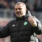 Ange Postecoglou celebrates with the Celtic fans after the victory over Hearts.