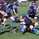 Biggar players (wearing red) in action against hosts Dalziel in the under-16 tournament (Pic courtesy of Dalziel Rugby Club)