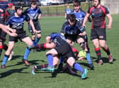 Biggar players (wearing red) in action against hosts Dalziel in the under-16 tournament (Pic courtesy of Dalziel Rugby Club)