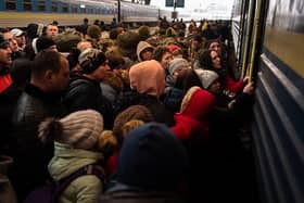 Refugees struggle to board a train at Lviv's main station, Ukraine. Picture: Gustavo Basso/NurPhoto via Getty Images