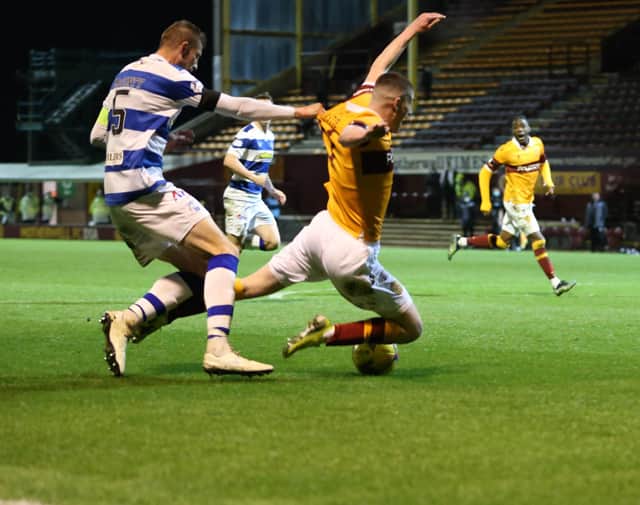 Jake Hastie goes down in box under Sean McGinty challenge