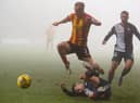 Partick Thistle's Scott Tiffoney is tackled by Dylan Tait last Saturday (Pic: Euan Cherry/SNS Group)