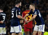 Ryan Porteous celebrates with Grant Hanley after Scotland defeat Spain 2-0 at Hampden Park. Picture: SNS