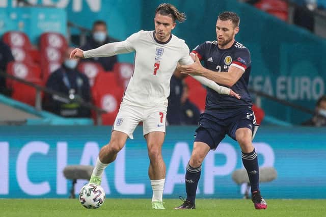 Stephen O'Donnell closely marked Jack Grealish. (Photo by CARL RECINE/POOL/AFP via Getty Images)