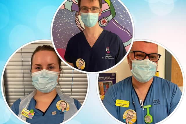 Erin, Ben and Alistair proudly wear the cartoon badges on their uniforms