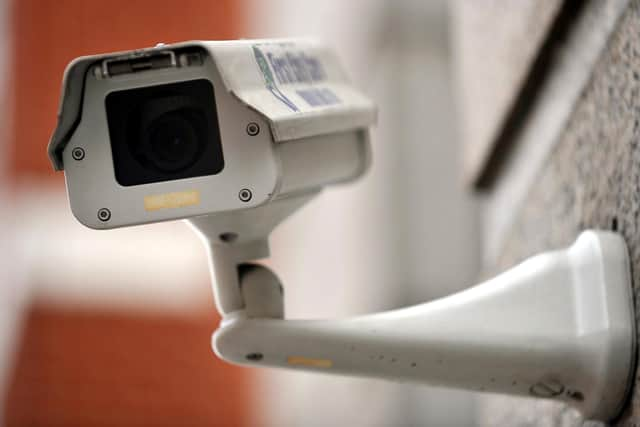 A generic picture of a CCTV camera on the side of a building