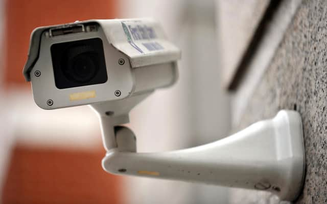 A generic picture of a CCTV camera on the side of a building