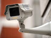A generic picture of a CCTV camera on the side of a building