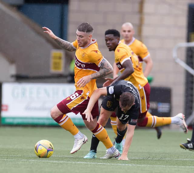 Callum Slattery gets away from Livi scorer Alan Forrest