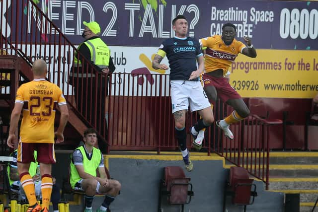 Bevis Mugabi leaps high for header