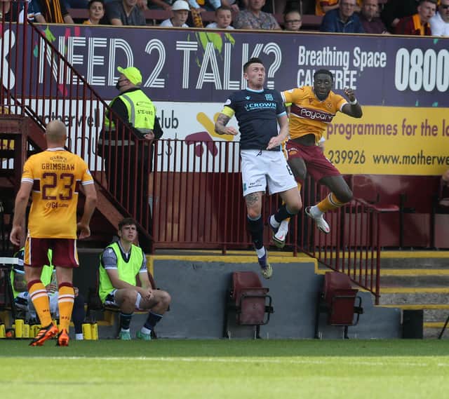 Bevis Mugabi leaps high for header