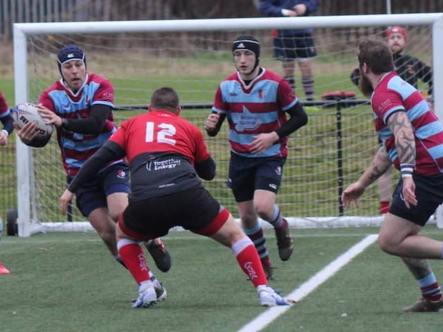 Cameron Quinn tries to make headway for Uddingston at Clydebank