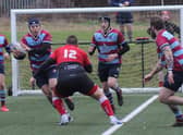 Cameron Quinn tries to make headway for Uddingston at Clydebank