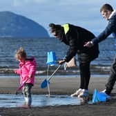 You may have to wrap up warm on the beach at Girvan, but there are some days when the sand is so hot it hurts your feet and the view of Ailsa Craig is lovely (Picture: John Devlin)
