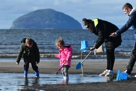 You may have to wrap up warm on the beach at Girvan, but there are some days when the sand is so hot it hurts your feet and the view of Ailsa Craig is lovely (Picture: John Devlin)