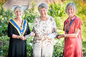 Jill Murie (left) from Lanark Rotary and Mhairi Jamieson (right) from Lanark Guildry present LCDT chairwoman Sylvia Russell with their cheques. The crowdfunder has now raised £2800 and counting.