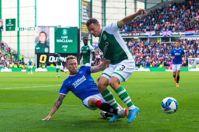 Rangers' Scott Arfield and Marijan Čabraja of Hibs vie for the ball during the last Easter Road meeting between Hibs and Rangers