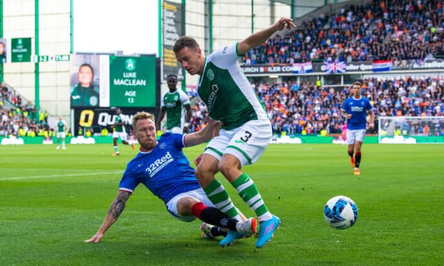 Rangers' Scott Arfield and Marijan Čabraja of Hibs vie for the ball during the last Easter Road meeting between Hibs and Rangers