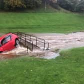 A car is washed away on Burnbraes Middle Brigde