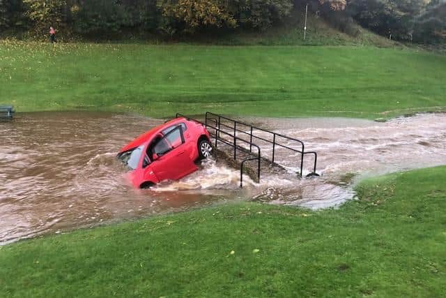 A car is washed away on Burnbraes Middle Brigde