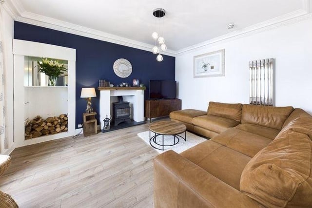 The fabulous open plan living room boasts a log burning stove, perfect for those cold winter days.