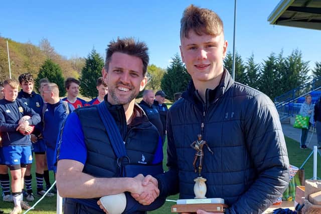 Graham Calder presents under-18 winners Biggar with Alan Calder Trophy