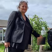 Giorgi Kakava and his gran Ketino Baikhadze at the tree planted in his mum Sopio’s memory