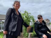 Giorgi Kakava and his gran Ketino Baikhadze at the tree planted in his mum Sopio’s memory