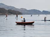 Kayakers and paddle boarders at Luss on Loch Lomond on Saturday. Picture: John Devlin