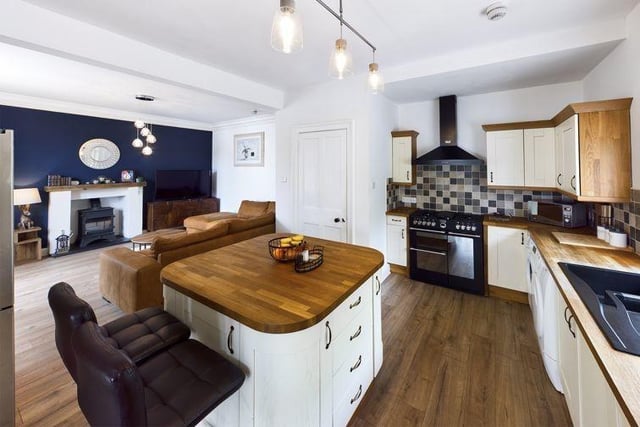 The kitchen is the real hub of this home and the current owners have opened up two rooms to create an open plan living room, dining area and country style kitchen with island unit.