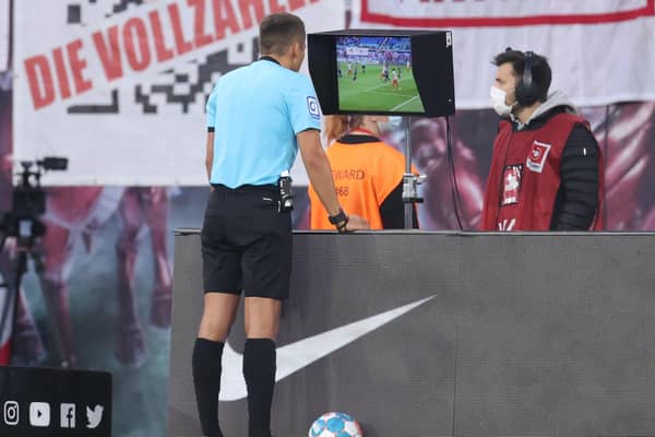 Referee checks VAR screen during a German league match (Pic by Alex Grimm/Getty Images)