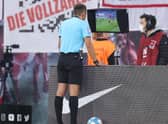 Referee checks VAR screen during a German league match (Pic by Alex Grimm/Getty Images)