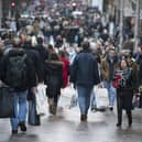 People carrying shopping bags on Buchanan Street in Glasgow's city centre. 