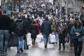People carrying shopping bags on Buchanan Street in Glasgow's city centre. 