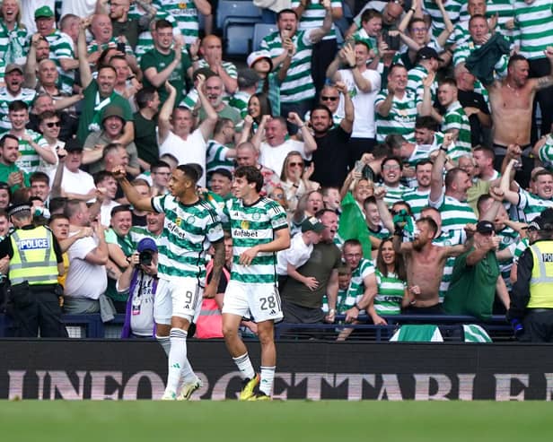 Celtic's Adam Idah (left) celebrates scoring the winner vs Rangers