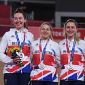 Katie Archibald (1st left), Neah Evans, Laura Kenny and Josie Knight celebrate on podium (Photo by Greg Baker/AFP via Getty Images)