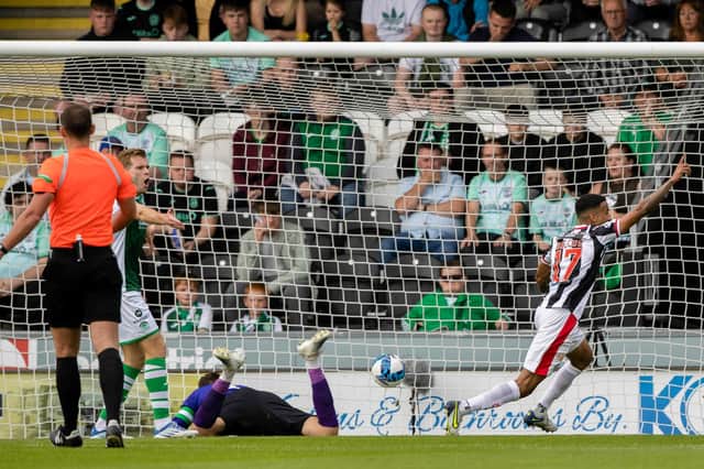 A disgruntled Hibs support watch on as Keanu Baccus gives St Mirren the lead early in the match in Paisley. Picture: SNS
