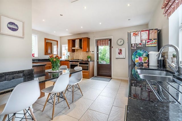 The kitchen has beautiful granite worktops and integrated appliances.