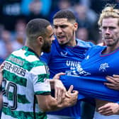 Celtic's Cameron Carter-Vickers grabs Rangers' Todd Cantwell by the shirt at full time.