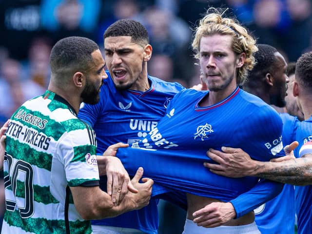 Celtic's Cameron Carter-Vickers grabs Rangers' Todd Cantwell by the shirt at full time.