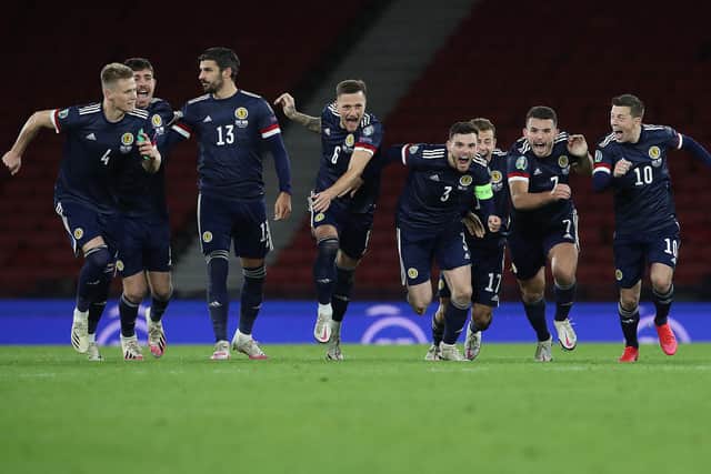 Scotland's Andy Robertson celebrates after his team's victory in the penalty shootout after their Euro 2020 play-off semi-final match against Israel at Glasgow's Hampden Park on October 8, 2020 (Photo by Ian MacNicol/Getty Images)
