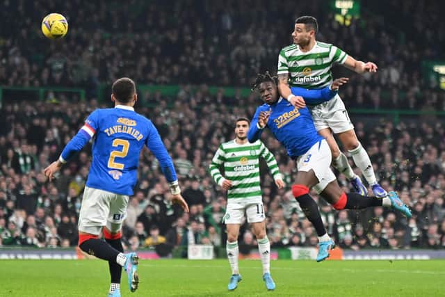 Celtic's Giorgios Giakoumakis outjumps Calvin Bassey of Rangers in the box. (Picture: John Devlin)