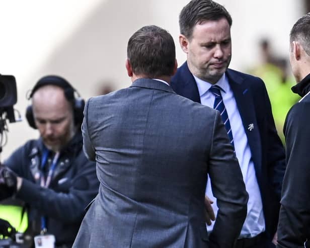 Celtic manager Brendan Rodgers shakes hands with Michael Beale after his team's 1-0 defeat of Rangers last month that the Irishman referenced in the "difficult" period that resulted in the 43-year-old losing his job. An outcome Rodgers acknowledges will be hard for his rival now, but whom he offered hope in suggesting "after the clouds comes the sunshine". (Photo by Rob Casey / SNS Group)
