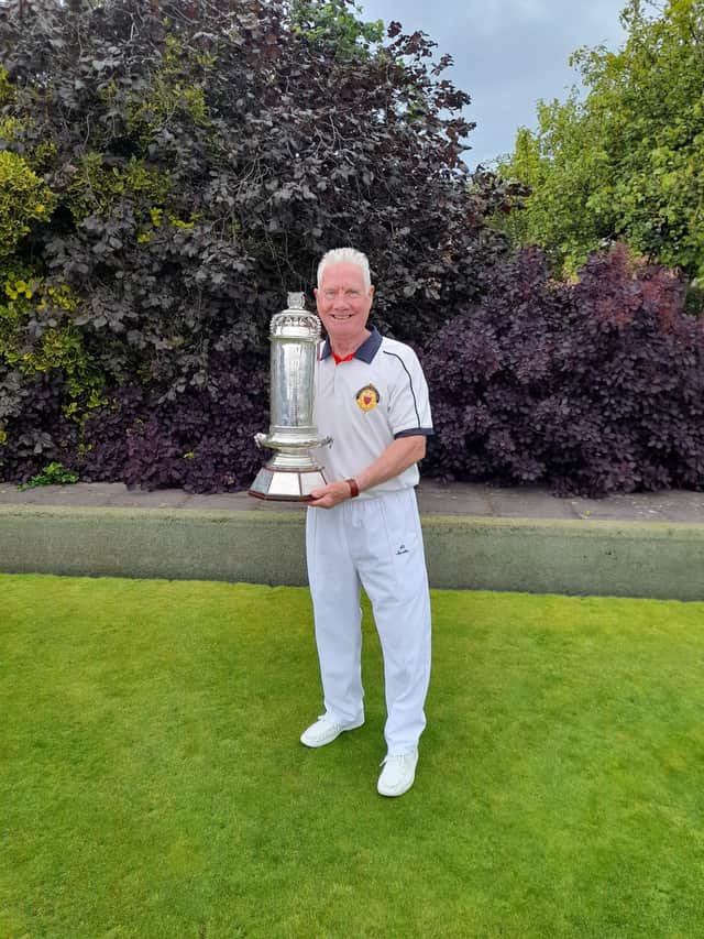 George Prosser holds Scottish Championship trophy aloft (Submitted pic)