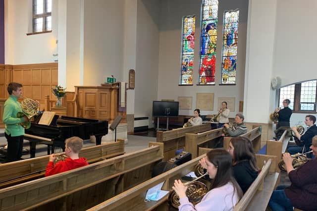 Horn soloist Ben Goldscheider performs with the amateur musicians at Bearsden Cross Parish Church