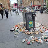 A full up bin along Buchanan Street.