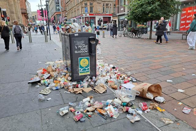 A full up bin along Buchanan Street.
