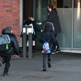 A Glasgow parents group has called for pupils to be allowed to wear uniform items without school crests