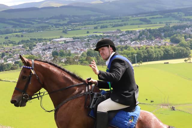 A stunning shot of Cornet Michael Allen with Biggar in the background.